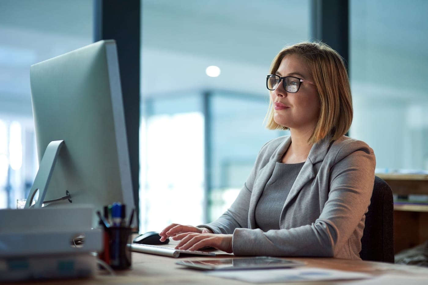 A team member working at her computer, ready to help survey participants